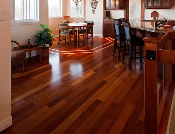 A stylish lounge with rich brown flooring, a wooden coffee table, and tasteful décor creating a warm and modern space.