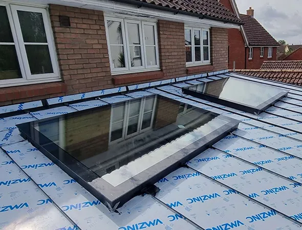 Two skylights installed side by side on the roof, bringing in abundant natural light and enhancing the room’s brightness and openness.