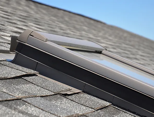 A sleek skylight installed on the roof, allowing natural sunlight to brighten the interior space below.