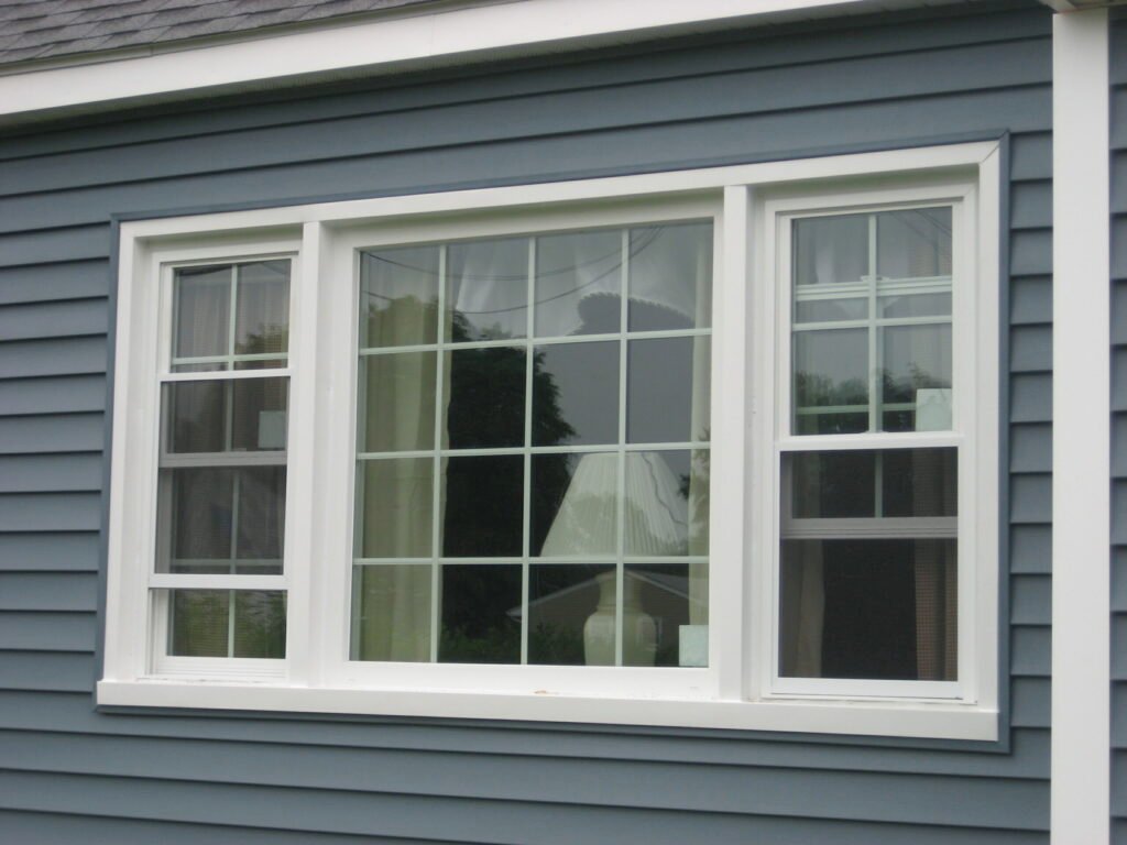 A vibrant blue exterior wall with a centered window, adding contrast and charm to the building’s facade.